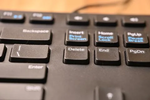 Minimal Black Keyboard Macro Composition Highlighting Delete Key in Soft Fo.. Stock Photos