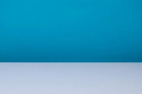 Minimal blue gradient background with reflective surface and copy space 写真素材