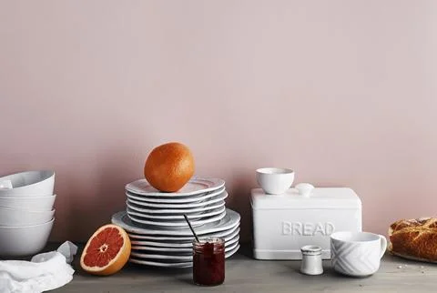 Minimal Breakfast Setup with Grapefruit and Bread Stock Photos