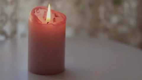 Minimal candle on white table with soft curtains in daylight Video stock 338180904