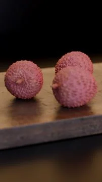 Minimal close-up of lychee fruits on rustic wood surface Stock Illustration