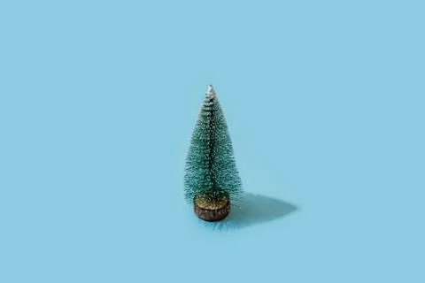 Minimal composition of Christmasa tree on blue background. trendy isometric Stock Photos