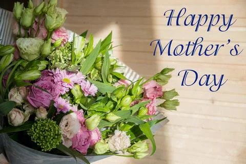 Minimal composition with a Eustoma flowers and next Happy mother's day on marble Stock Photos