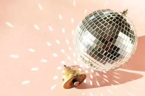 Minimal creative. Christmas decorations and mirror disco balls on sand color  Foto stock