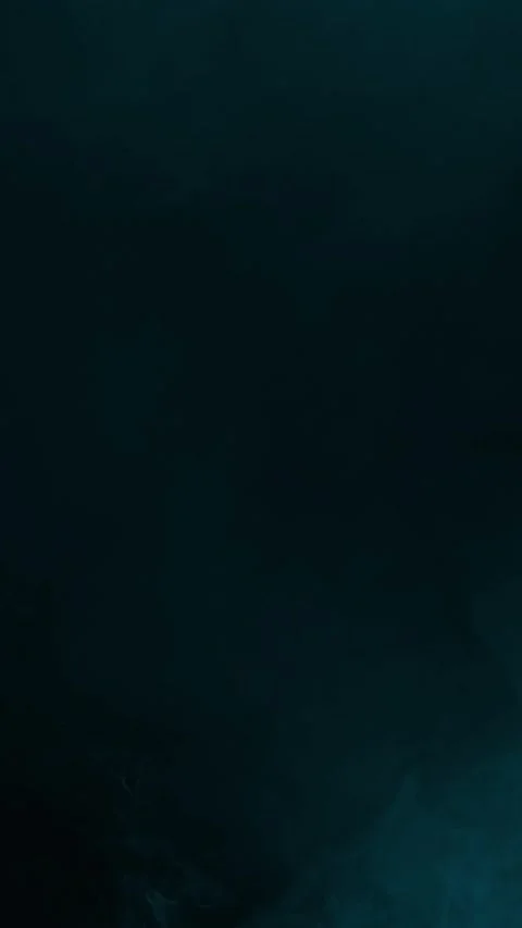 Minimal cyan smoke on a vast dark copy space background, vertical format 스톡 동영상 340147161