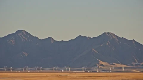 Minimal desert landscape with distant power transmission towers Stock-Footage 326240692