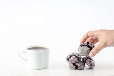 Minimal designed scene, a coffee cup and dark chocolate cookie over plain whi Stockfoto's