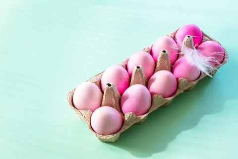 Minimal Easter concept. Easter elements, paper box with eggs in pink colors o Stock Photos