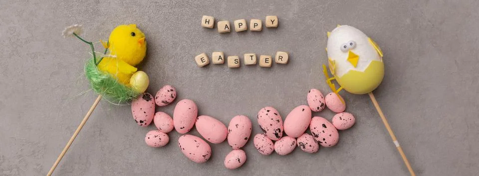 Minimal Easter concept. Pink eggs and easter decor with text Happy Easter Stock Photos