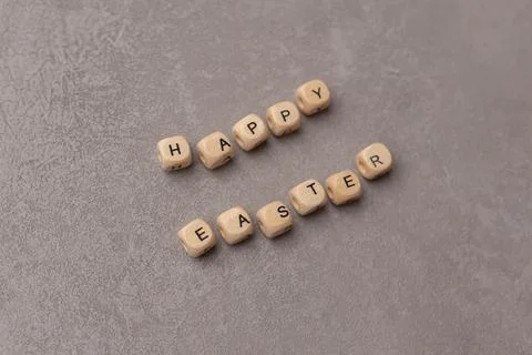 Minimal Easter concept. Text Happy Easter on grey background Stock Photos