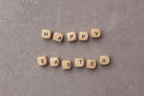 Minimal Easter concept. Text Happy Easter on grey background Stock Photos