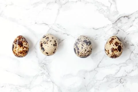 Minimal easter decoration with eggs on white marble background Stock Photos