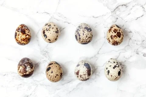 Minimal easter decoration with eggs on white marble background 스톡 사진