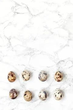 Minimal easter decoration with eggs on white marble background Stock Photos