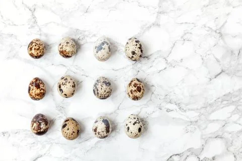 Minimal easter decoration with eggs on white marble background Stock Photos