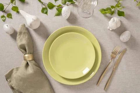 Minimal Easter place setting with pastel tableware Stock Photos