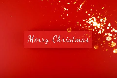 Minimal flat lay Christmas theme. Merry Christmas written on red tablet with Ilustración de archivo