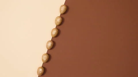 Minimal flat lay concept of rotating Easter glitter gold eggs. Stop motion Stock Footage 150283633
