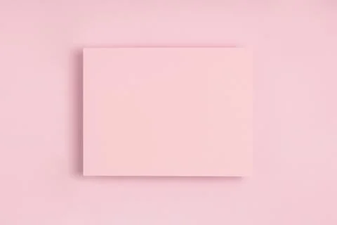 Minimal frame geometric composition mock up. Blank sheet of pink postcard on  Stock Photos