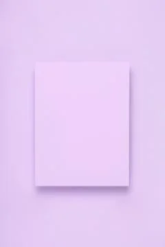 Minimal frame mock up. Blank sheet of lilac paper postcard on delicate lilac Stock Photos