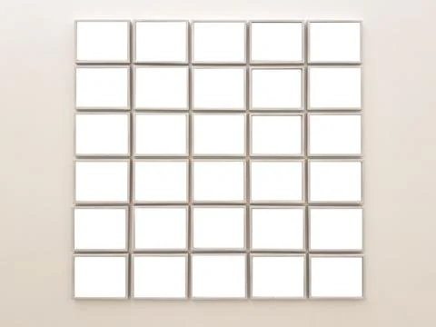 Minimal gallery wall of empty picture frames. Neutral interior decor with cle Stock Photos