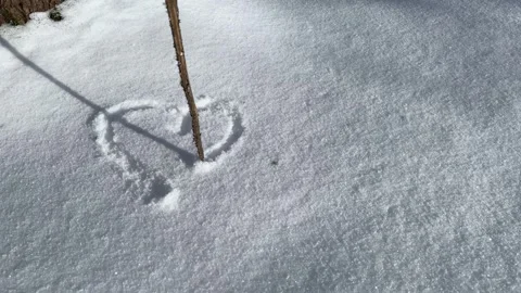 Minimal heart drawn in snow with copy space Stock Footage 328613637