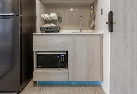 Minimal kitchen corner in residence. small kitchen counter ideas in the apa.. Stock Photos