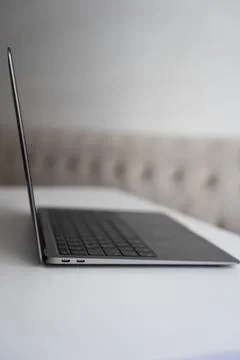 Minimal laptop with white sofa background Stock Photos