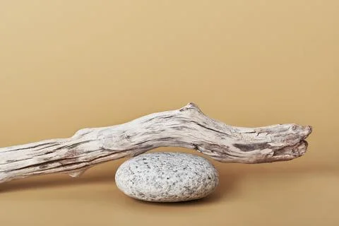 Minimal natural product display on beige background. Stone pebble podium and Stock Photos