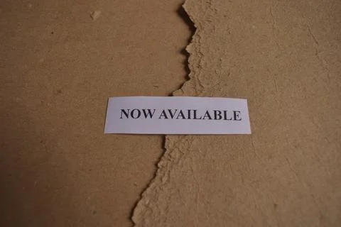 Minimal Now Available typography label on vintage kraft paper with copy space Fotos de archivo
