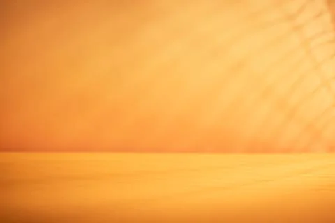 Minimal orange tabletop with subtle blurred shadows and copy space for autu.. Stock Photos