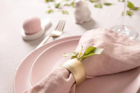 Minimal pastel pink Easter plate with gold cutlery Stock Photos