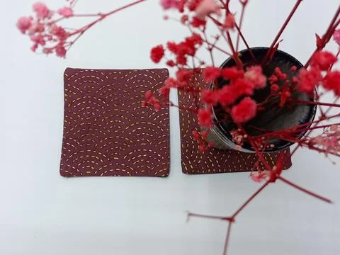 Minimal patchwork coasters with decorative flowers. Fotos de archivo