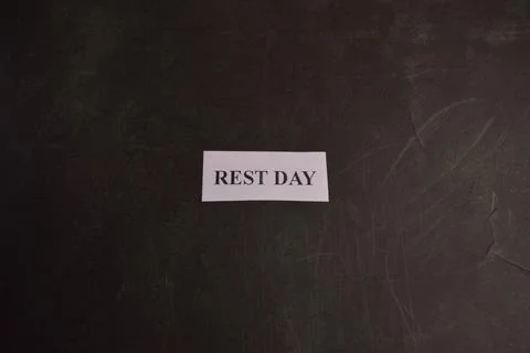 Minimal Rest Day typography message card with modern dark backdrop Fotos de archivo