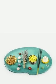 Minimal Spa Composition With Candles Stones And Incense On Green Background Stock Photos