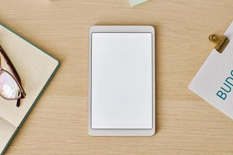 Minimal top view digital tablet with white screen mockup at light wood desk Stock Photos