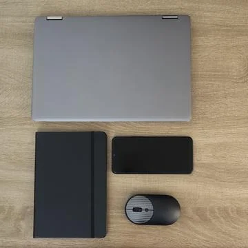 Minimal top view layout of closed laptop, notebook, and mouse Stock Photos