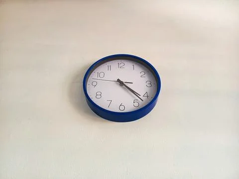 Minimal Wall Clock on White Background Representing Time Management Stock Photos