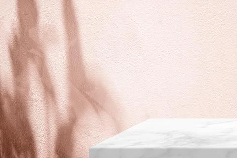 Minimal White Marble Table Corner with Shadow and Pink Light Beam on Wall. Stock Photos