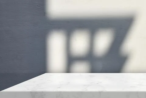 Minimal White Marble Table Corner with Shadow and Light Beam on Wall. Stock Photos