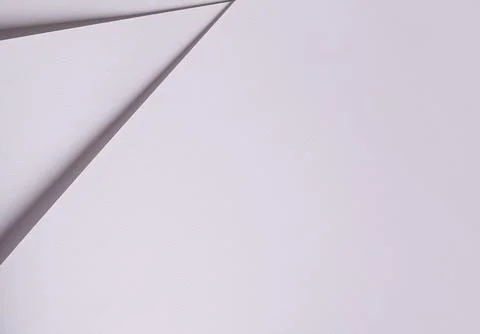 Minimal white paper background with sharp diagonal folds. Clean abstract te.. Stock Photos