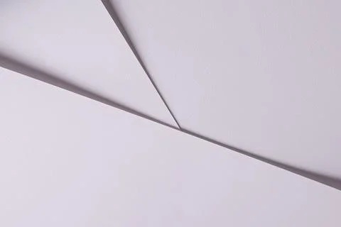 Minimal white paper background with sharp folded lines. Clean abstract surfac Stock Photos