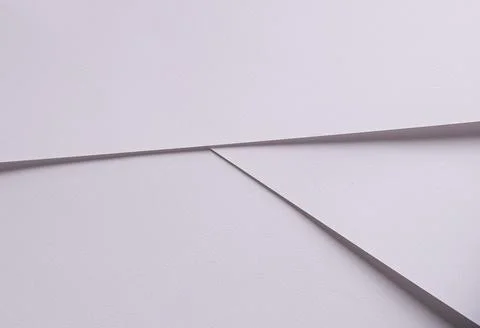 Minimal white paper texture with folded edges. Clean abstract stationery Fotos de archivo
