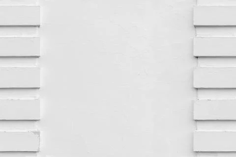 Minimal white plaster wall featuring a vertical side columns, seamless Stock Photos