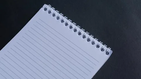 Minimal work space, top view of note book on black background. note book copy Stock Photos