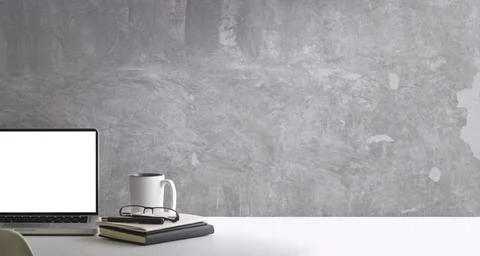 Minimal workplace with laptop computer, coffee cup and book on white table. B Stock Photos