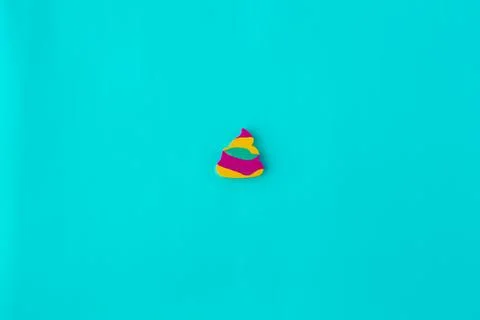 Minimalism, multi-colored children's eraser on a blue background Stock Photos