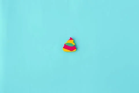 Minimalism, multi-colored children's eraser on a blue background Stock Photos