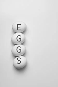 Minimalism style top view of four eggs white background farming organic natur Stock Photos