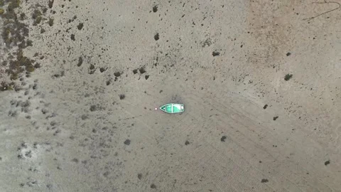 Minimalist Aerial Top-Down View of a Green Dinghy on Sand Flats at Low Tide Stock Footage 330781459
